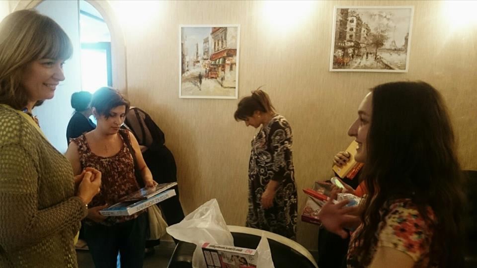 Sandra Roelofs and her son hand out gifts to people affected by the Tbilisi Flood geotv.ge
